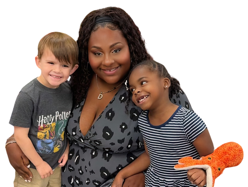 A teacher and two children cheerfully share a moment together in a cozy setting.